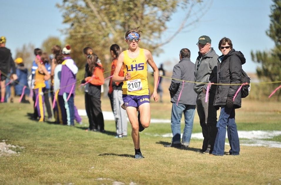 Evan Moore running during a cross country race. 